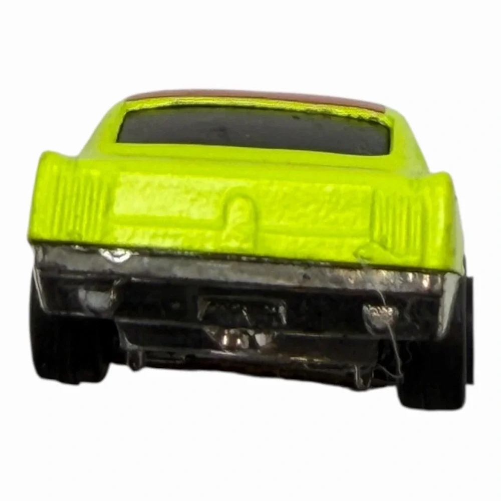 Vintage Yellow Diecast Toy Car with Racing Decals‎
